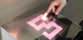 Novel tactile display using computer-controlled surface adhesion